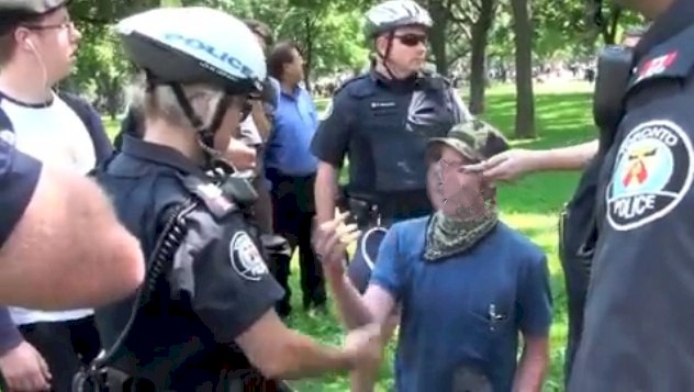 Police Sgt. Tries Repeatedly to explain circumstance to protester. This video would be excellent training material for security and police.